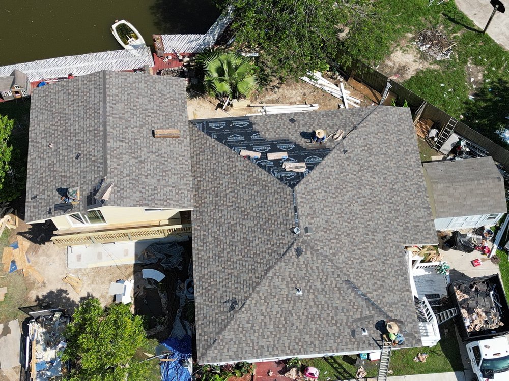 Aerial view of completed architectural shingle roof replacement in Houston